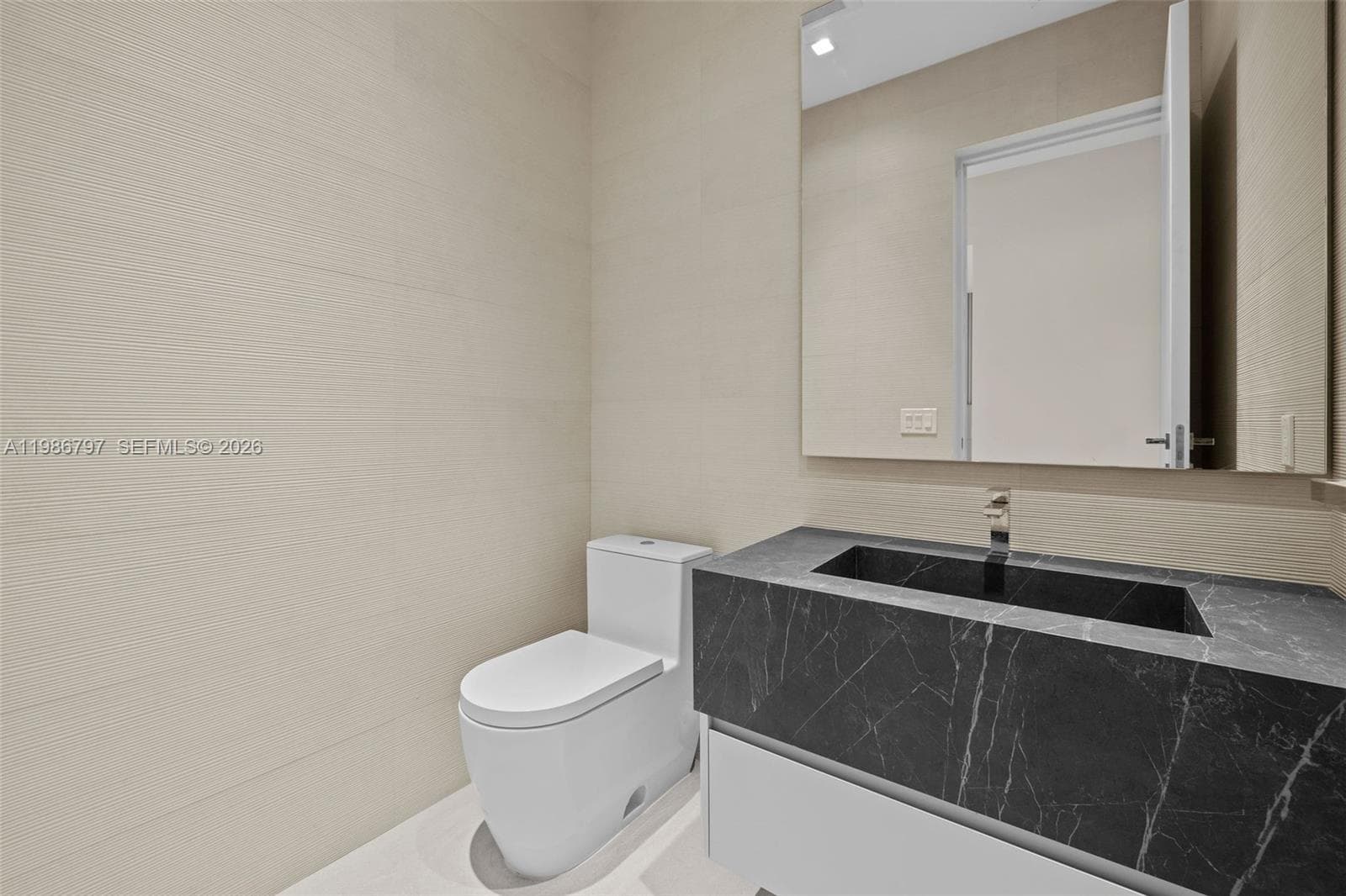 Powder Room - Located off Entry Foyer