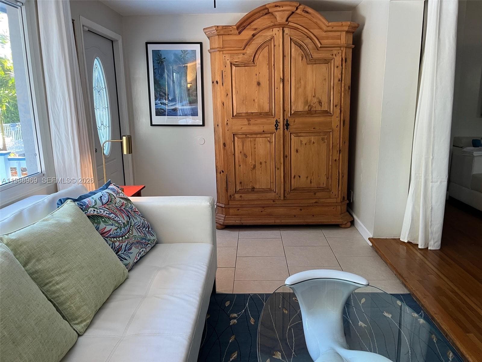 Florida room with sofa bed and private deck.