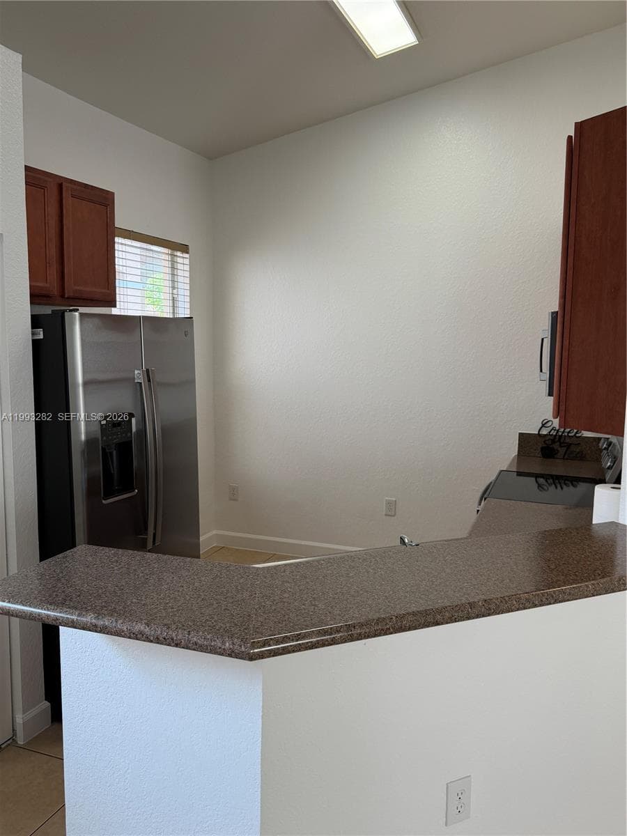 Nice sized kitchen with brand new stainless steel appliances.