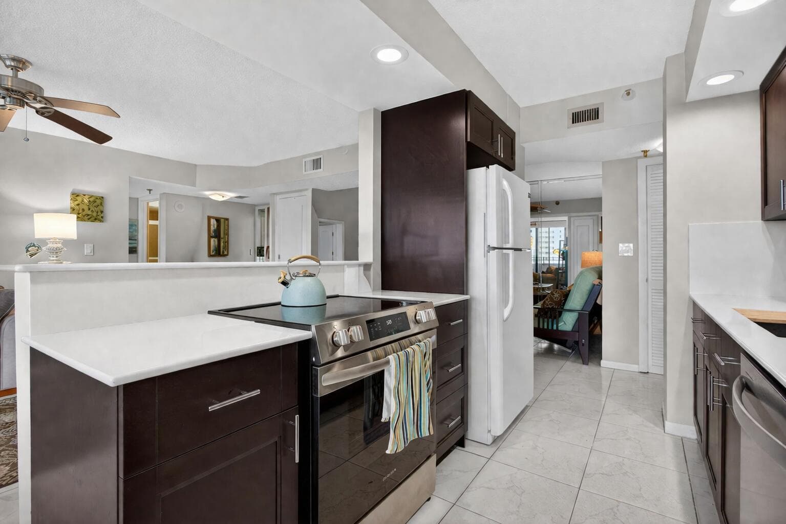Modern open kitchen with dark cabinetry