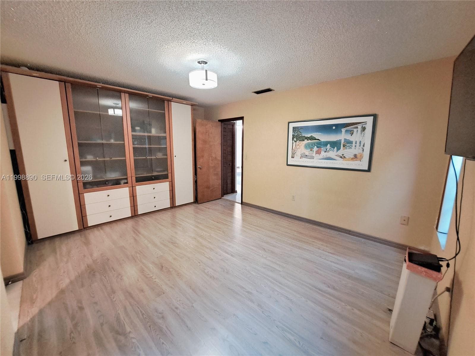 Master bedroom with custom built wall unit