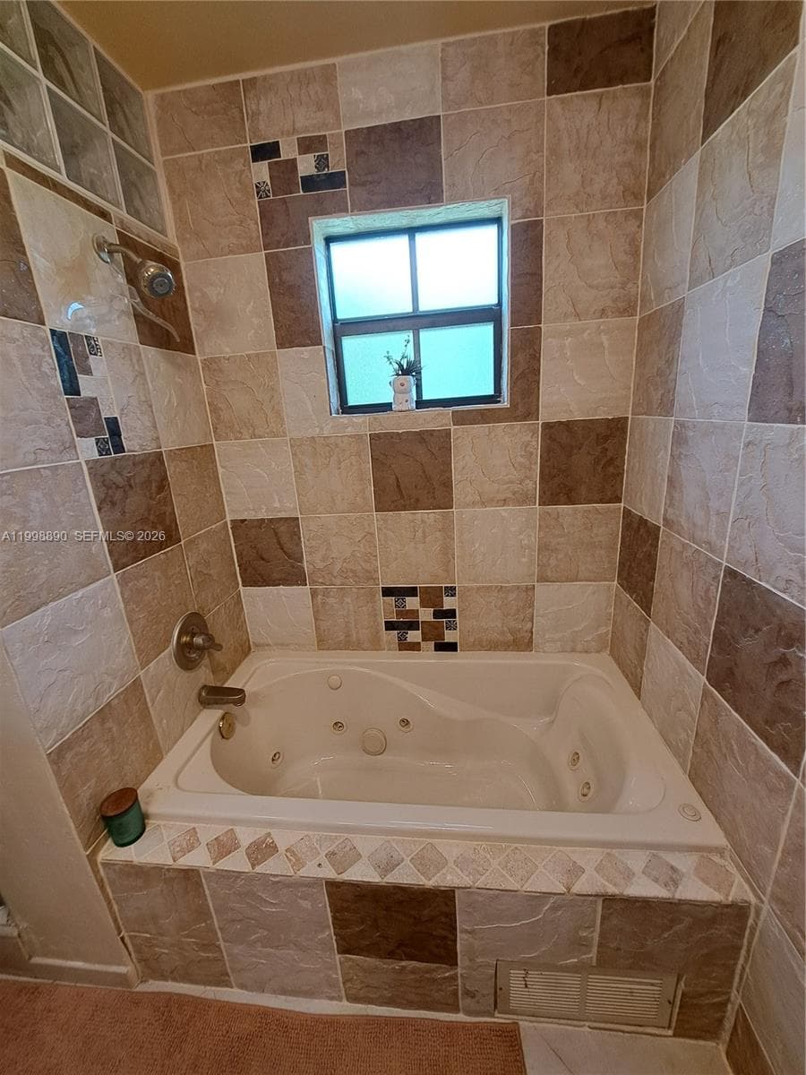 Mater Bathroom with Jacuzzi and impact window
