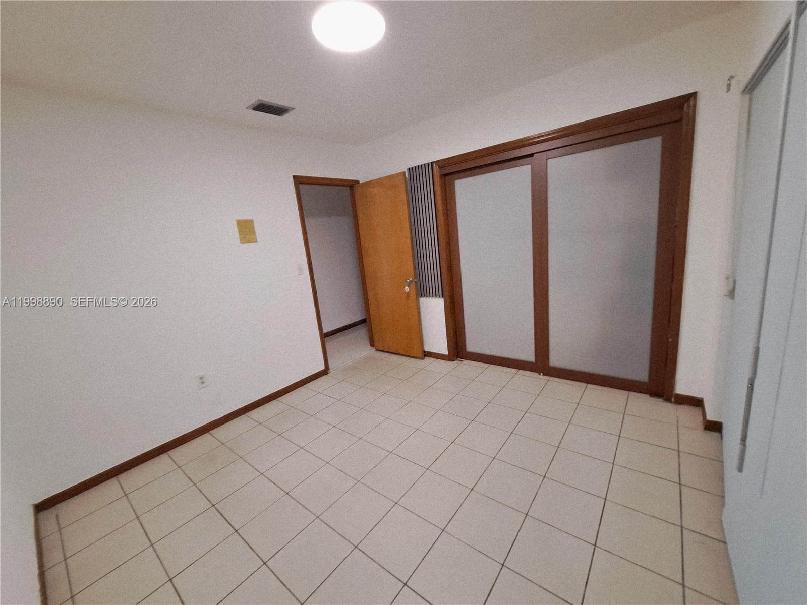 3rd bedroom with rollup  shutters