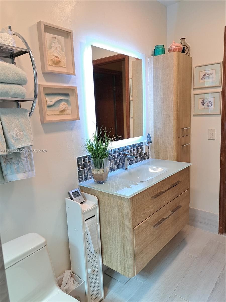 Guest bathroom with glass shower tiles