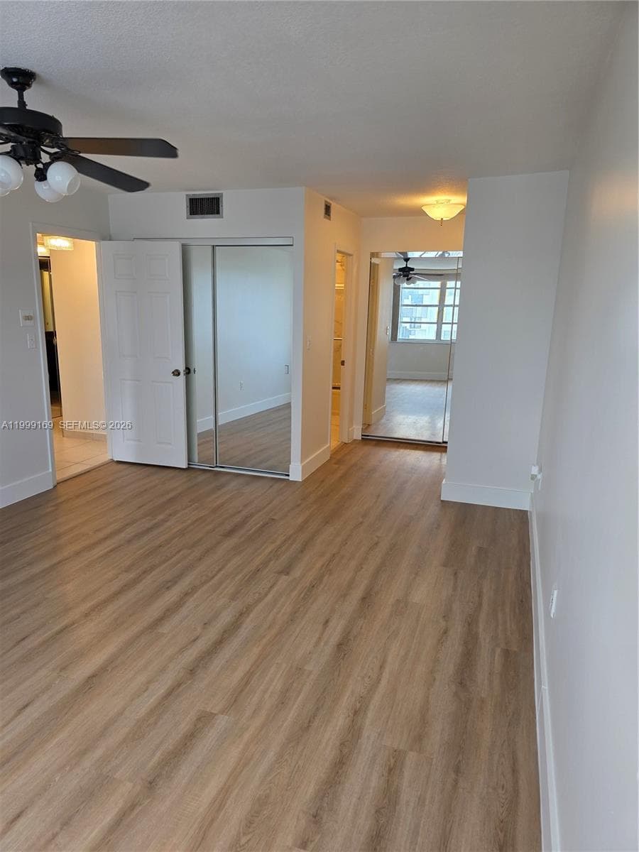 MASTER BEDROOM WITH BEAUTIFUL NEW FLOORING & GREAT VIEW