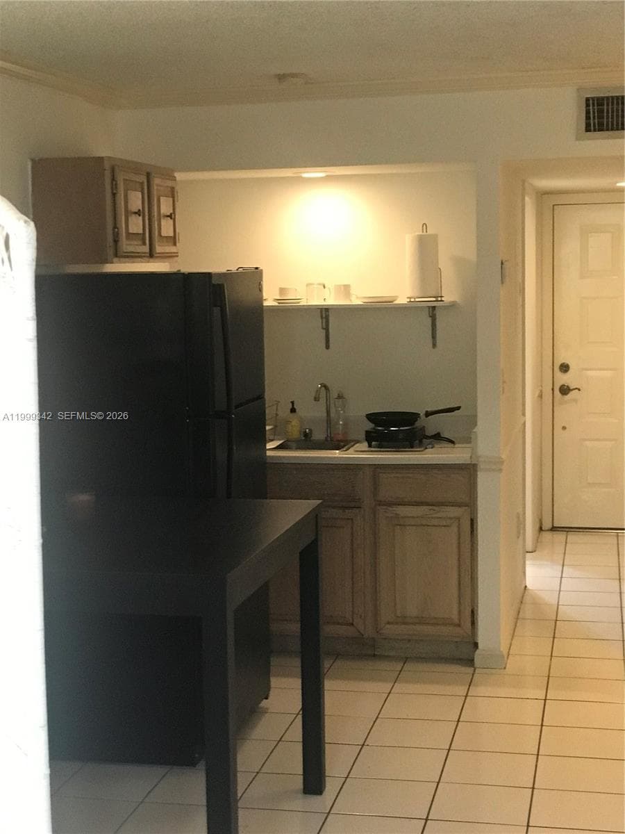 Kitchen area with Refrigerator