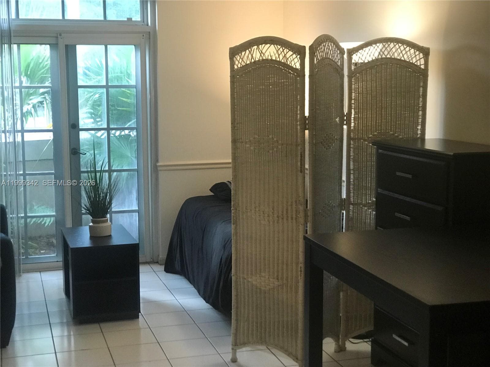 FURNISHED Interior with French doors to walled balcony
