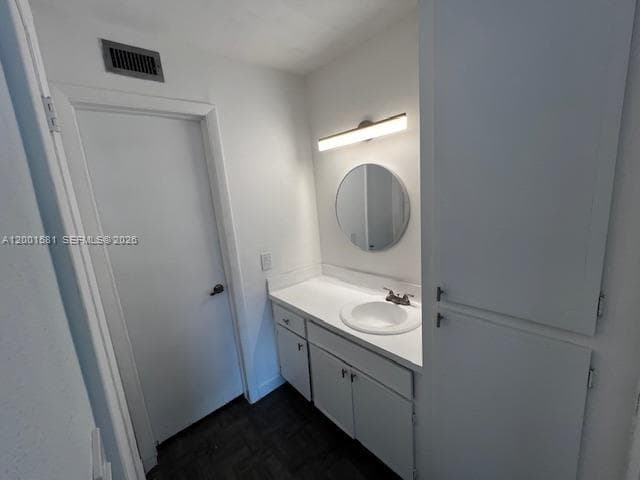 VANITY AREA IN MASTER BEDROOM WITH CABINET FOR SHEETS AND TOWELS