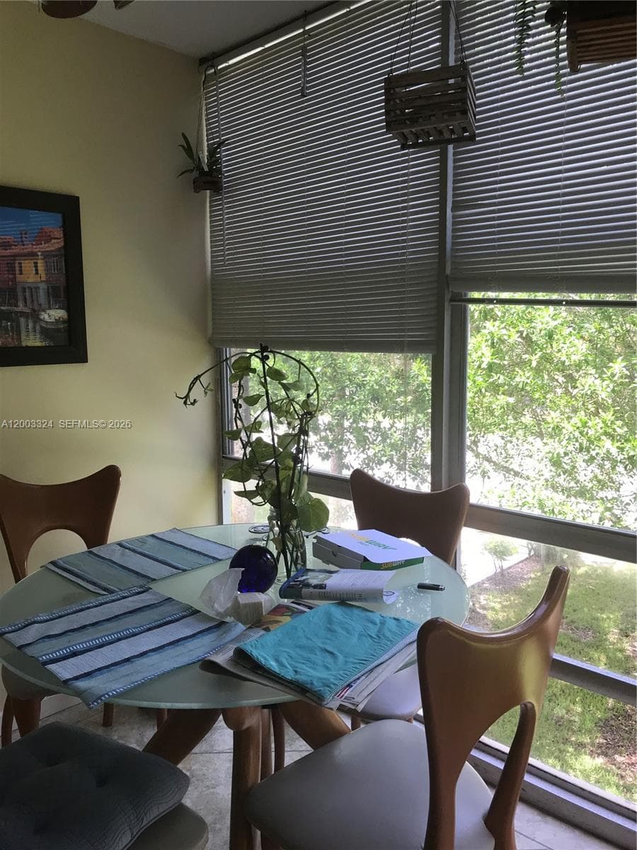 Living room-floor to ceiling windows with shutters