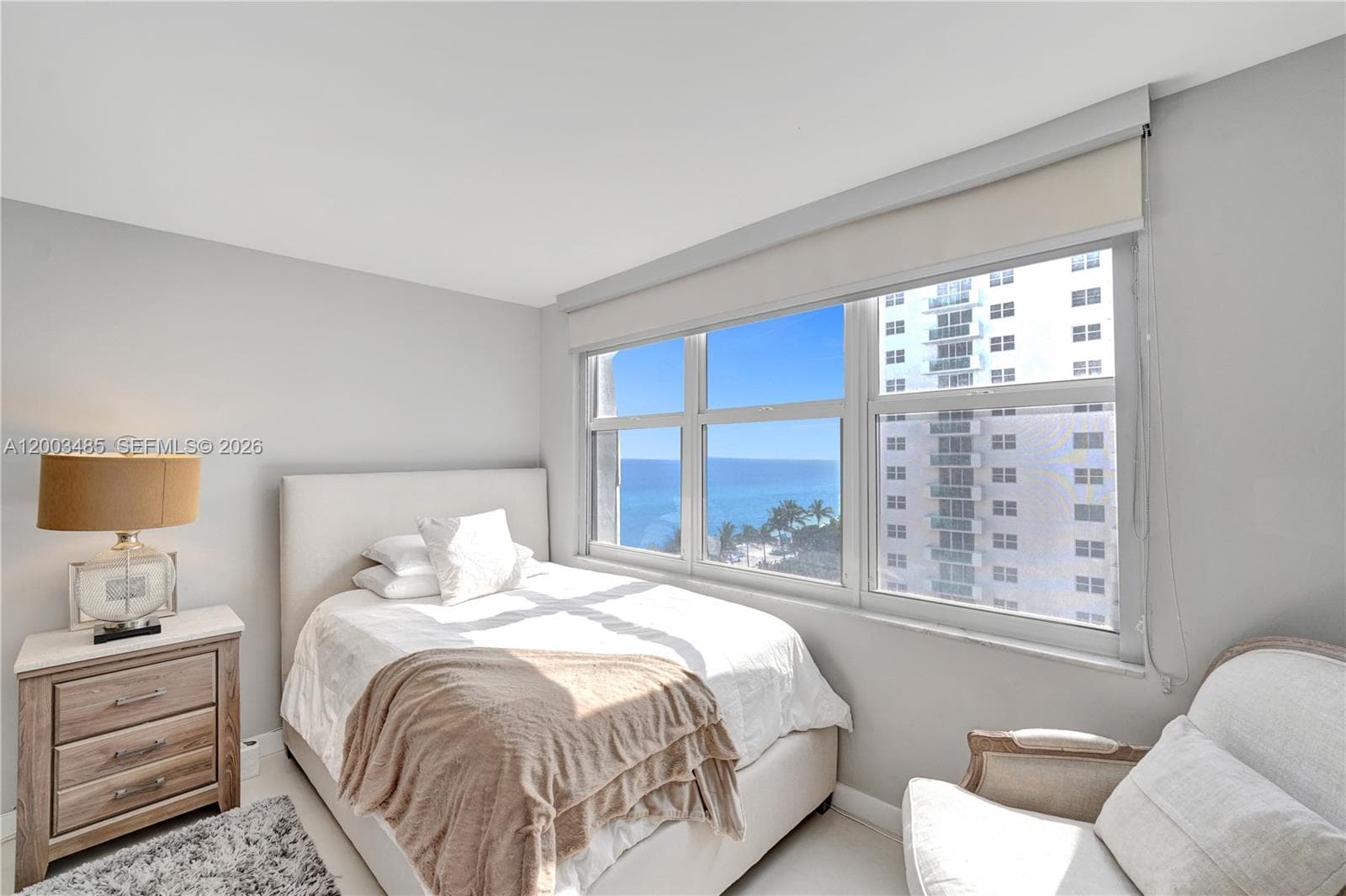 Ensuite-large guest bedroom  features ocean view