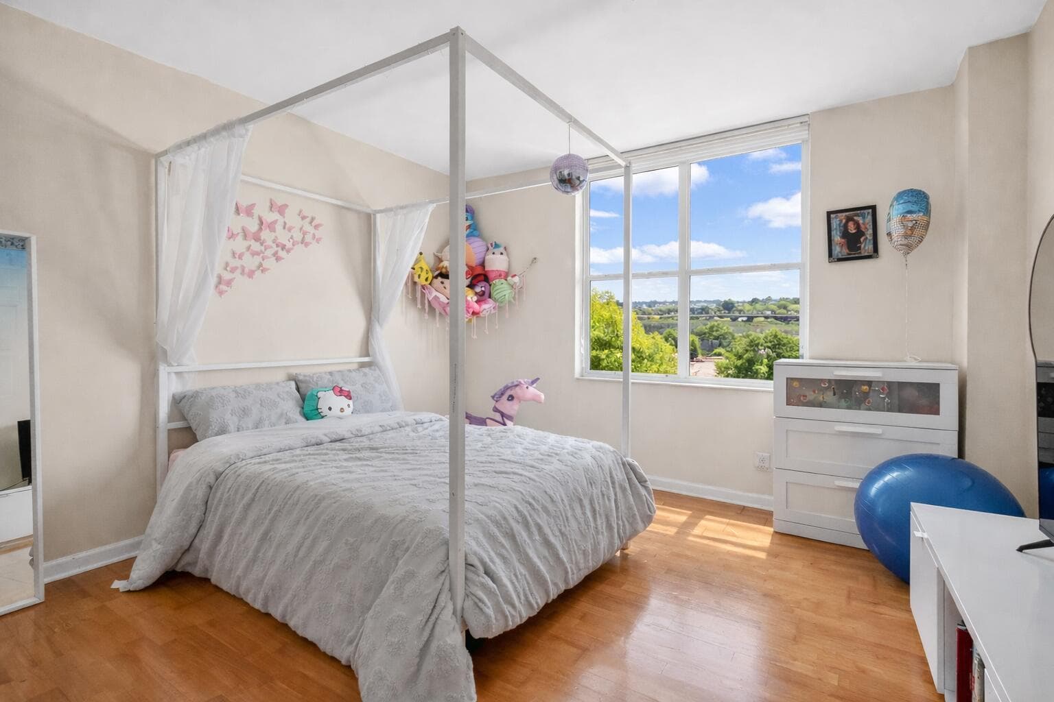 Bright and cozy bedroom with butterflies