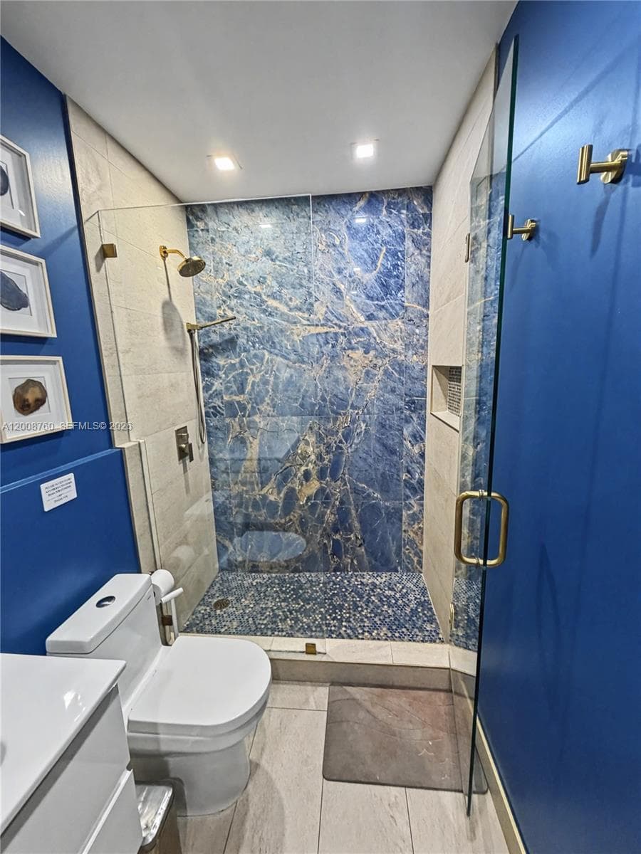 Modern bathroom — designer tile, custom shower, and updated finishes