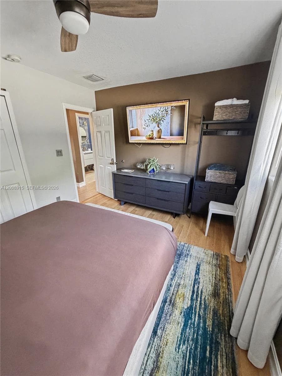 Bright primary bedroom with stylish design throughout