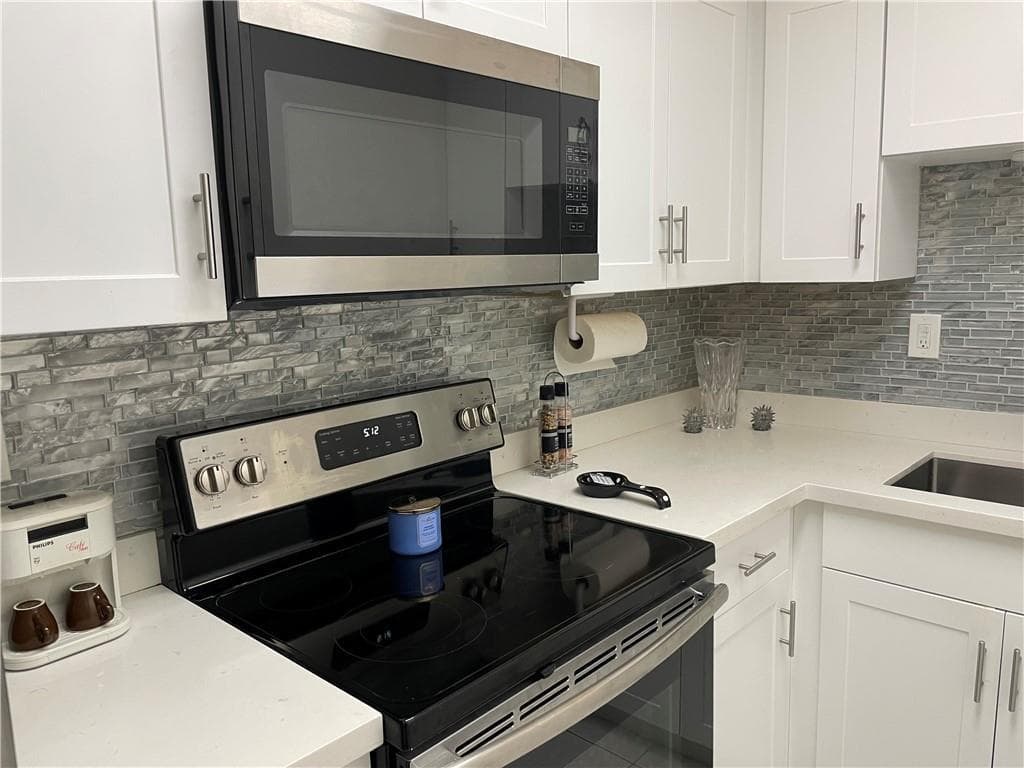 Quartz Countertops and modern backsplash