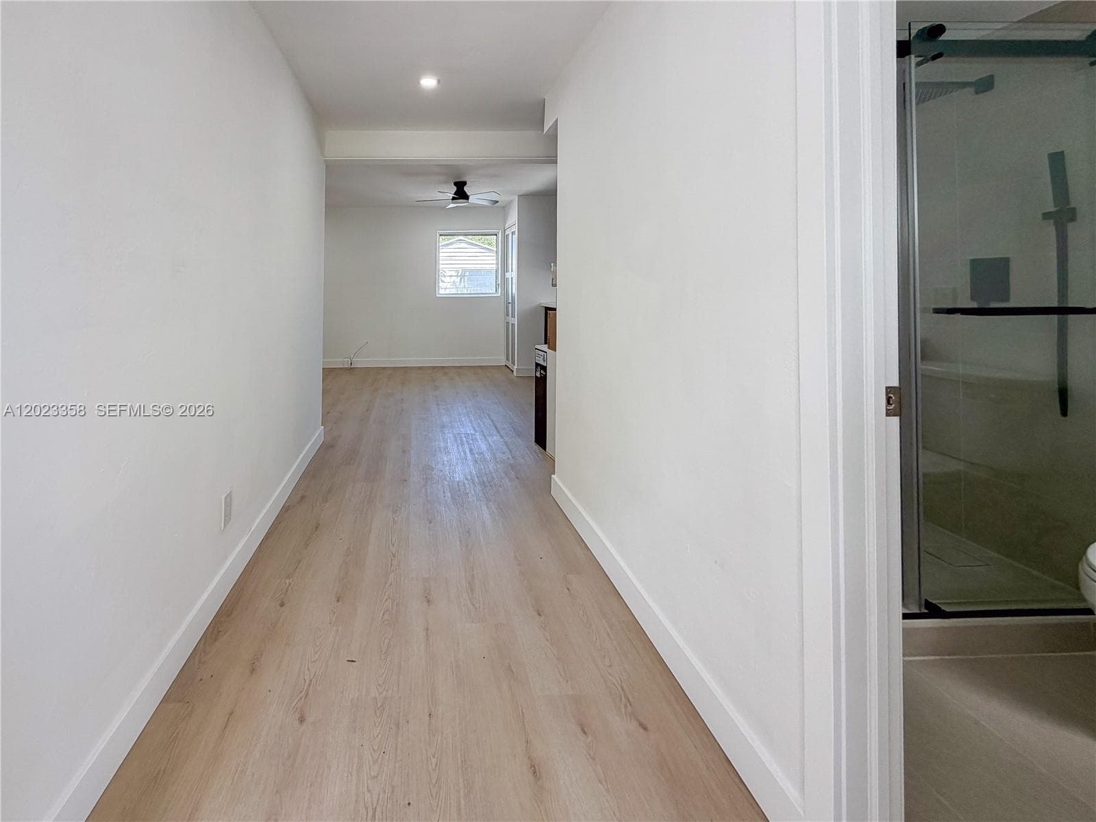 Entrance hallway with the bathroom on your right hand side.