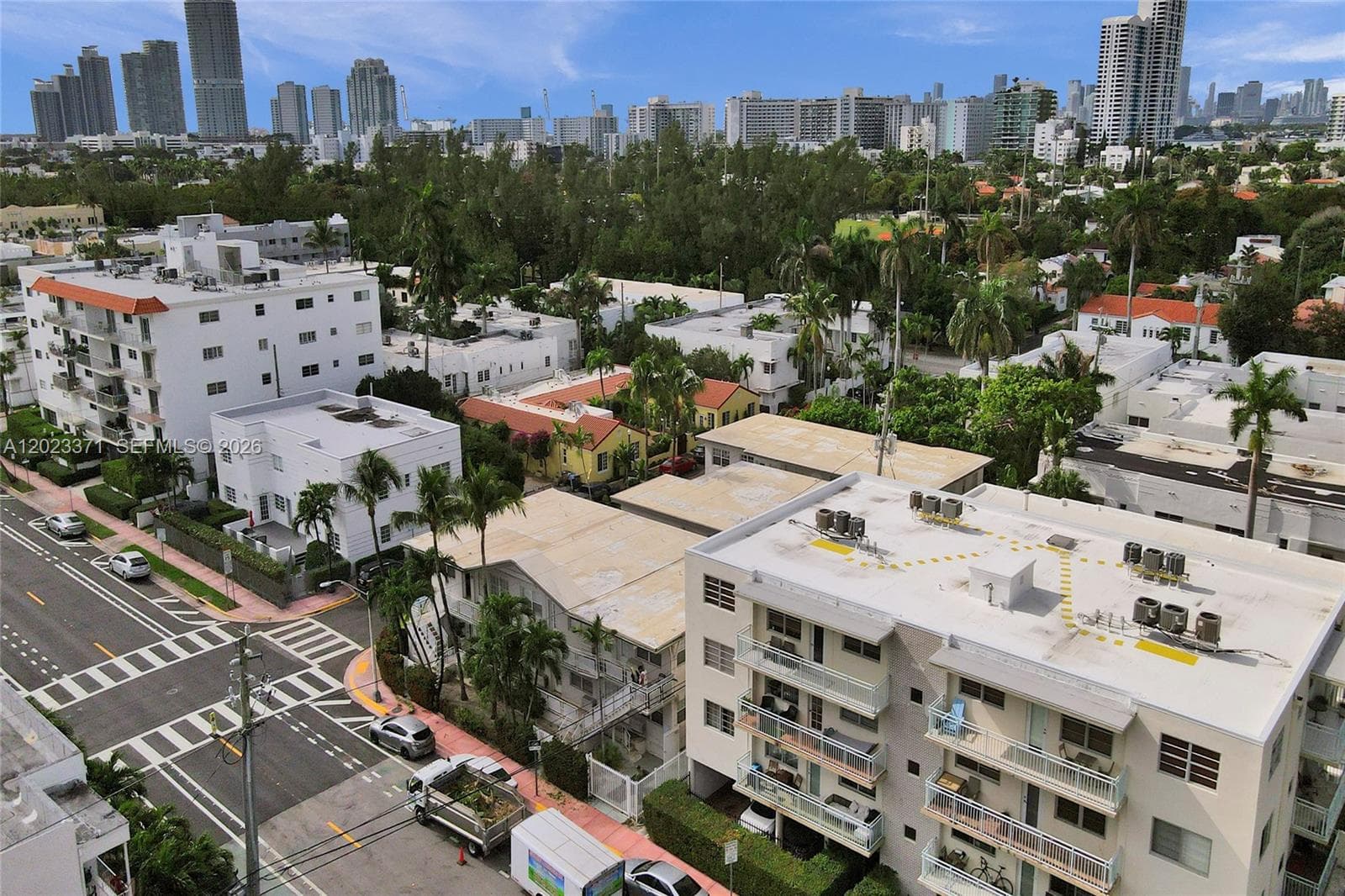 Flamingo Park with pool and tennis courts is in the background.  717 Espanola Way is the tan roof building
