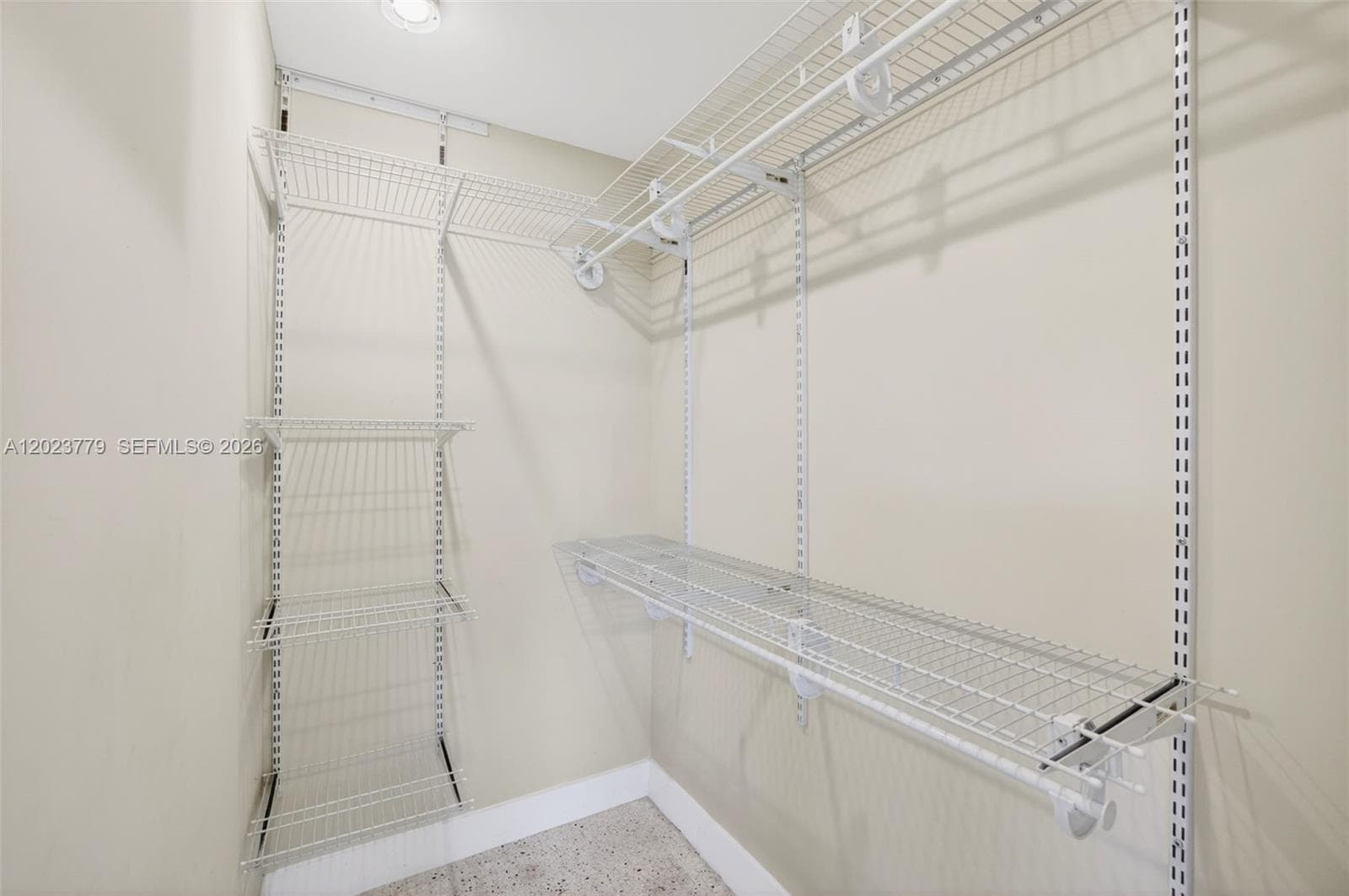 Primary walk in closet w/ upgraded adjustable shelving