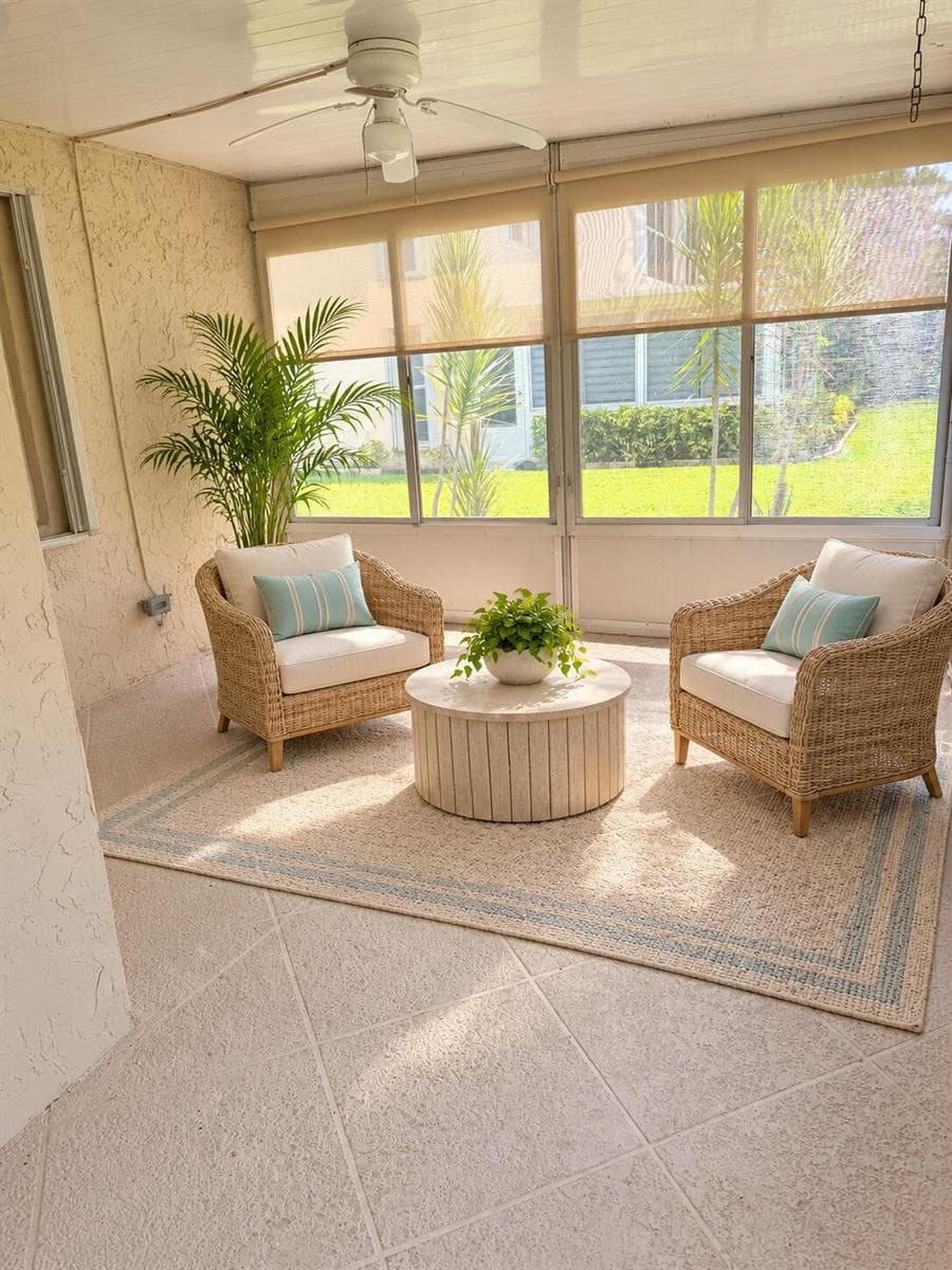 Florida sunroom with airy rattan seating