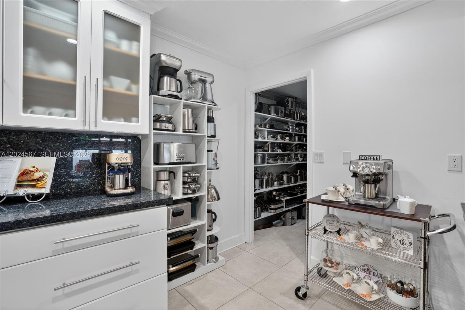 Kitchen that leads to the pantry
