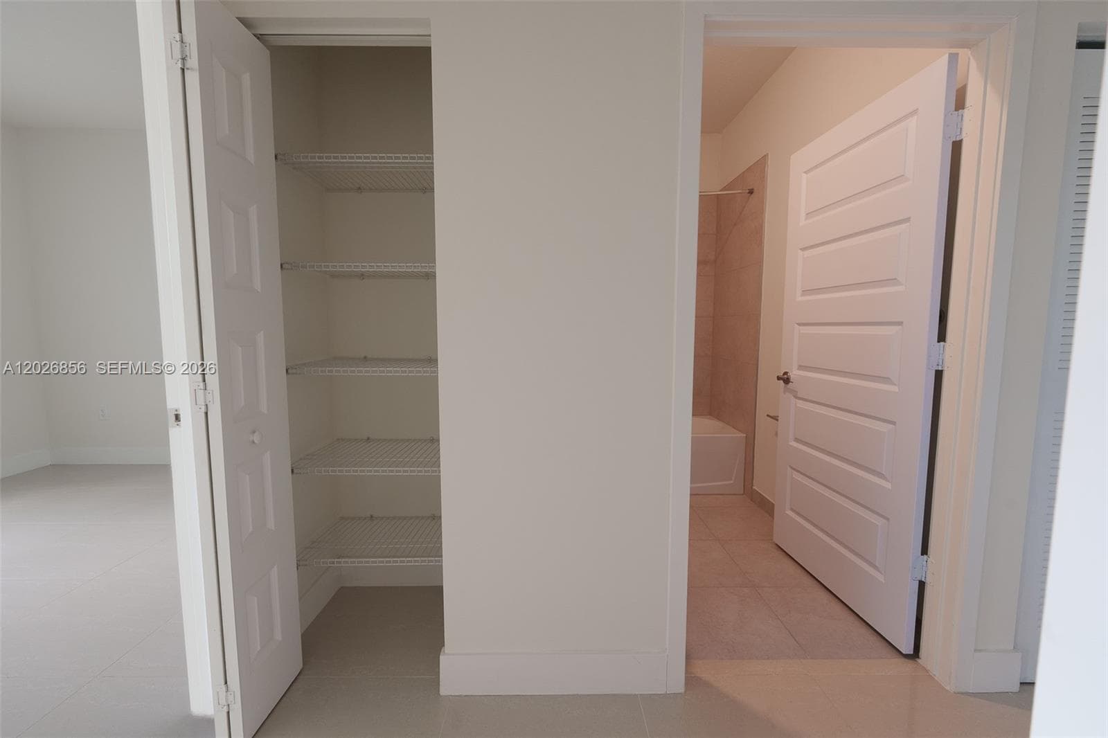 Hallway closet and guest bathroom