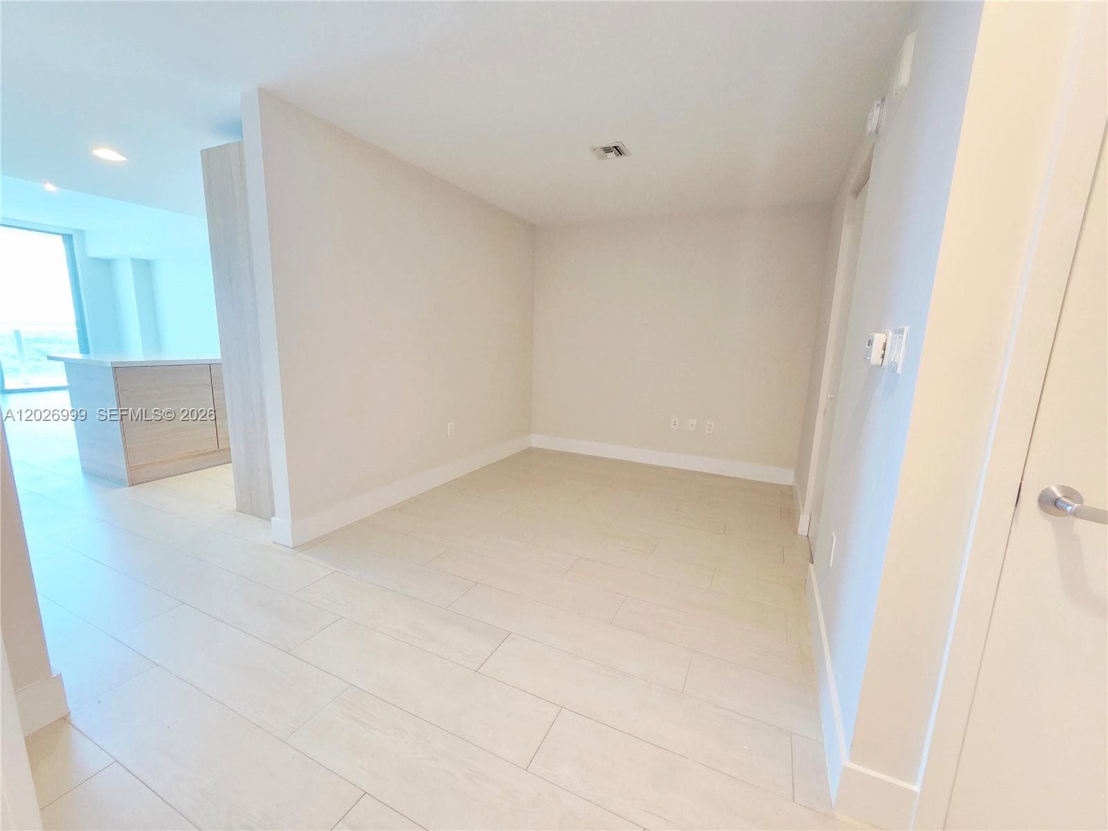 Secondary angle highlighting the bedroom layout with access to the closet and adjoining hallway, offering a clear flow between living spaces.