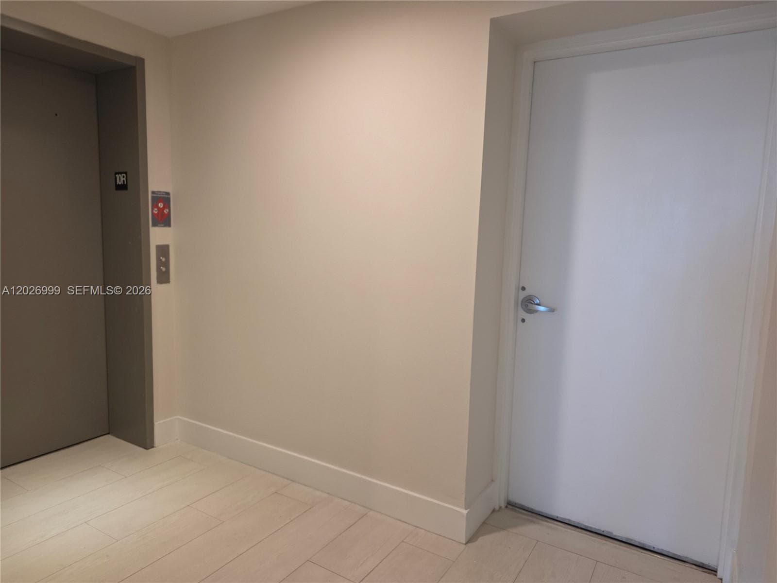 The spacious weight area includes an extensive free-weight collection, benches, and specialized machines, all set against a clean, contemporary backdrop.