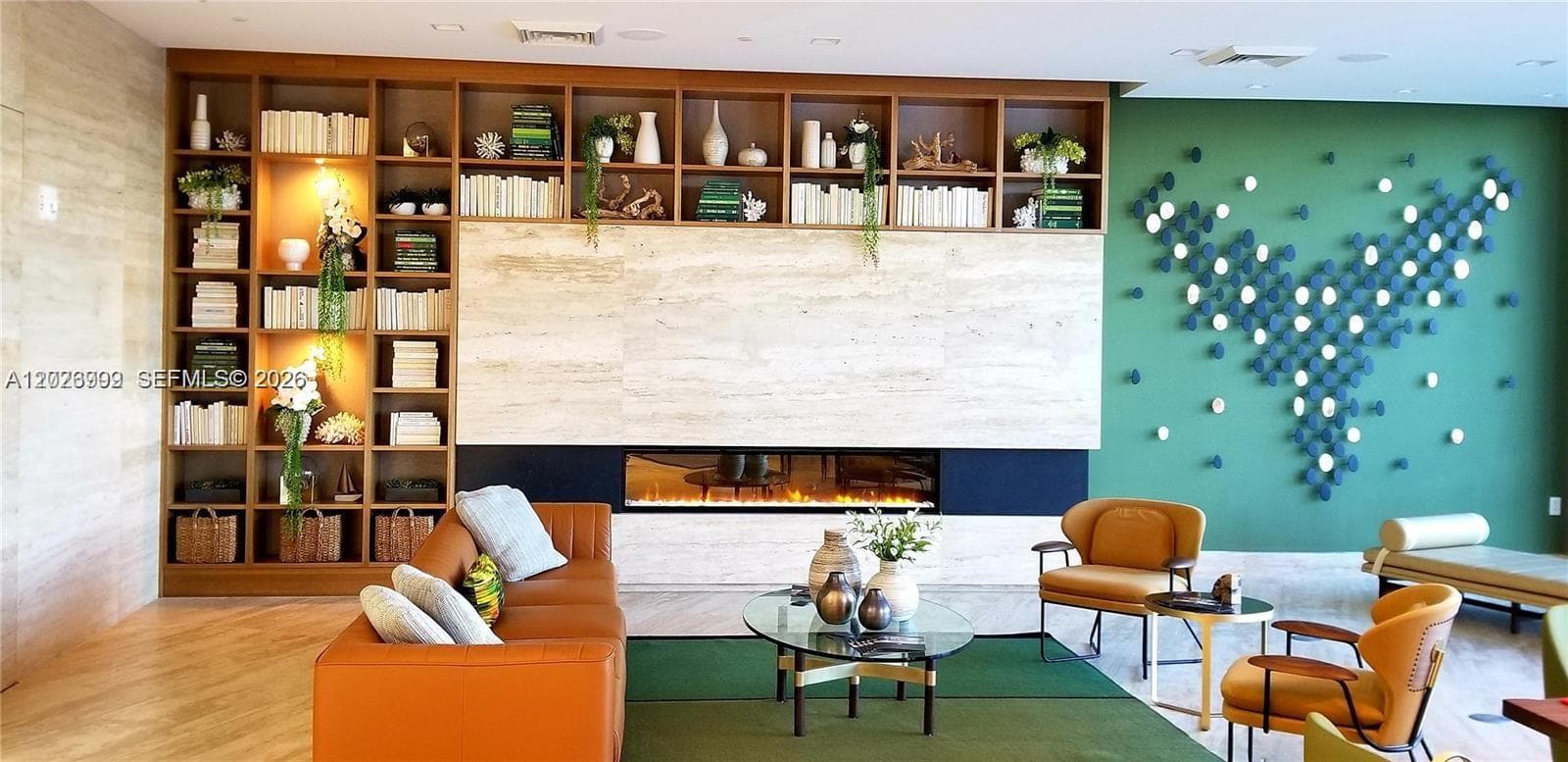 The unit offers sweeping water and skyline views, framed by lush greenery and surrounding cityscape vistas. This outlook adds a scenic backdrop directly from the residence.