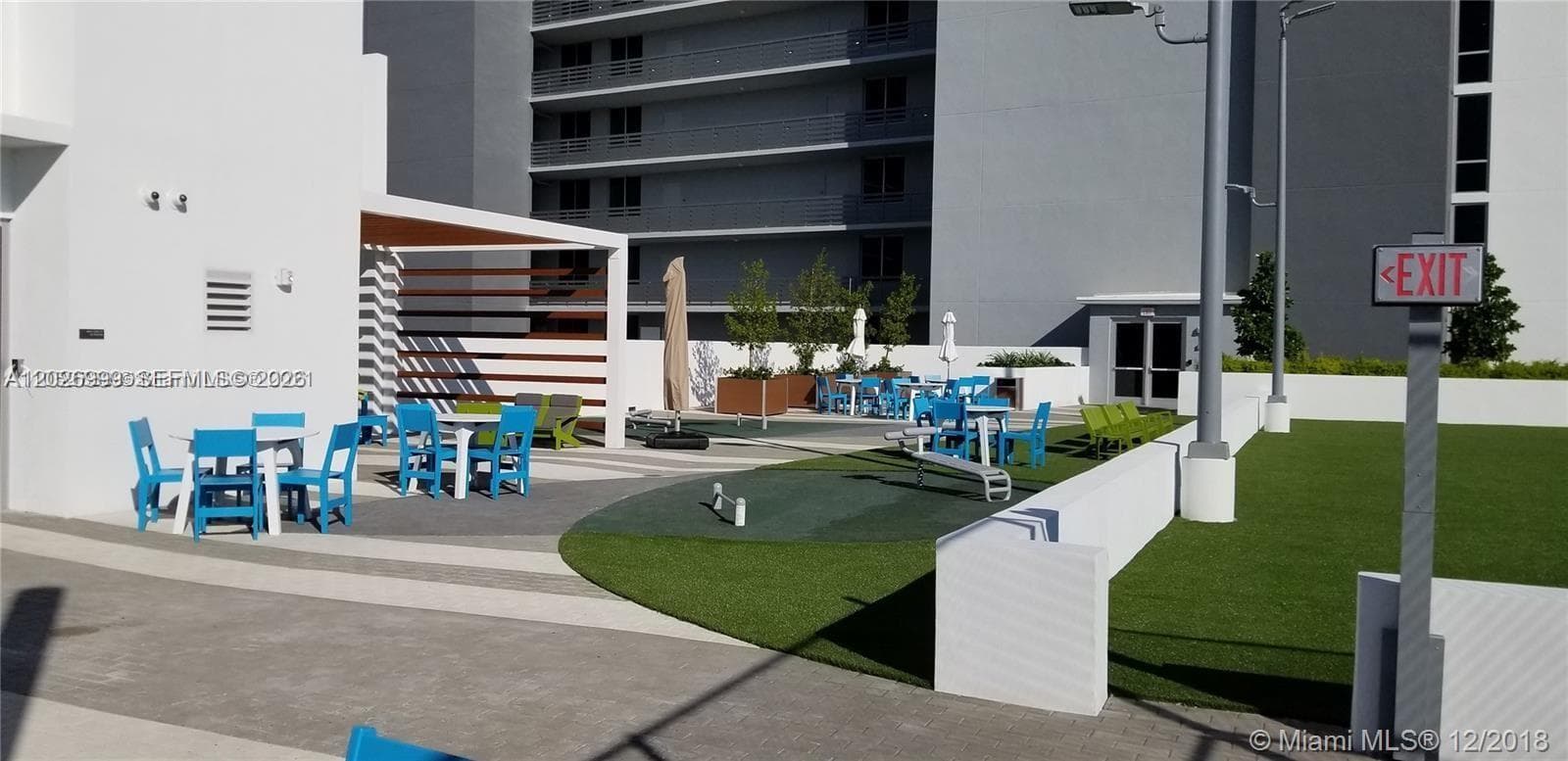 A dedicated outdoor basketball court offers additional space for recreation within the building’s amenity collection.