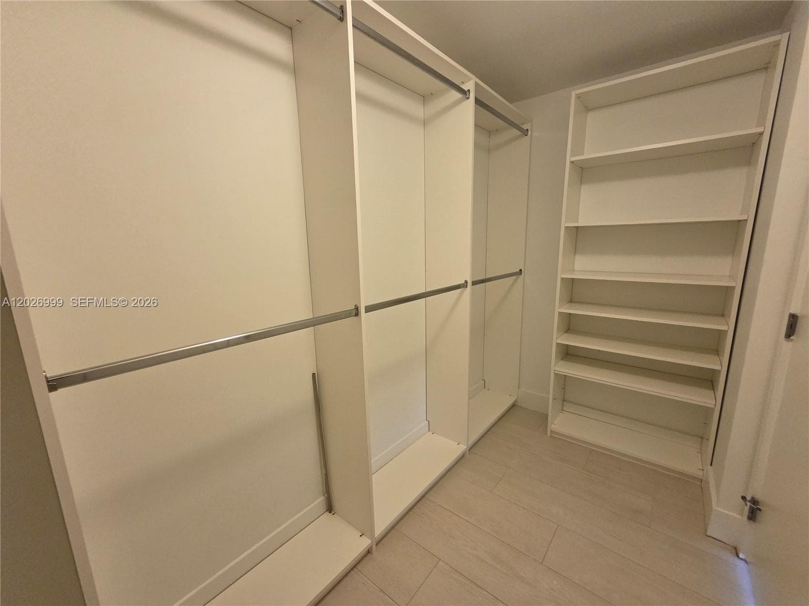 The residence opens from a clean, modern elevator landing with neutral finishes and direct access to the unit entrance.