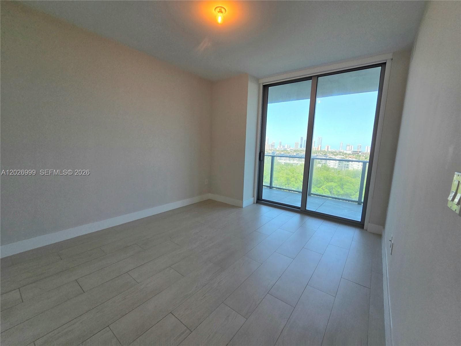 The bathroom features a double vanity, large mirror, glass-enclosed shower, and direct access to the walk-in closet.