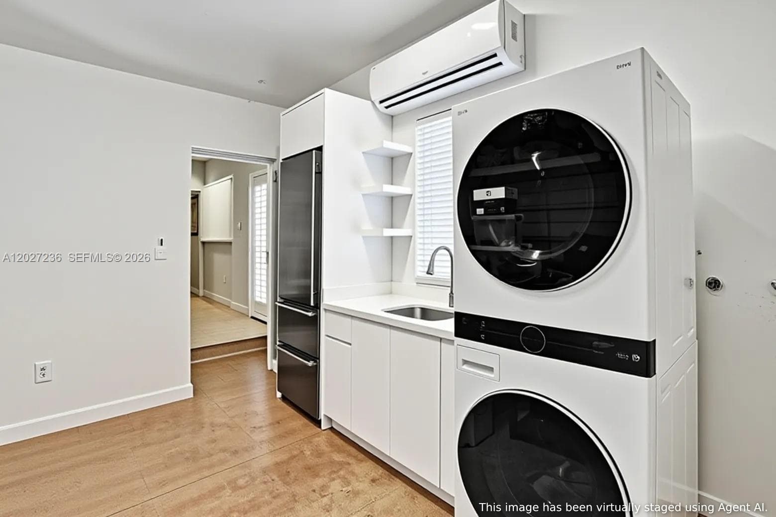 2 Car Garage has a stackable LG Washer/Dryer & an extra Subzero Refrigerator