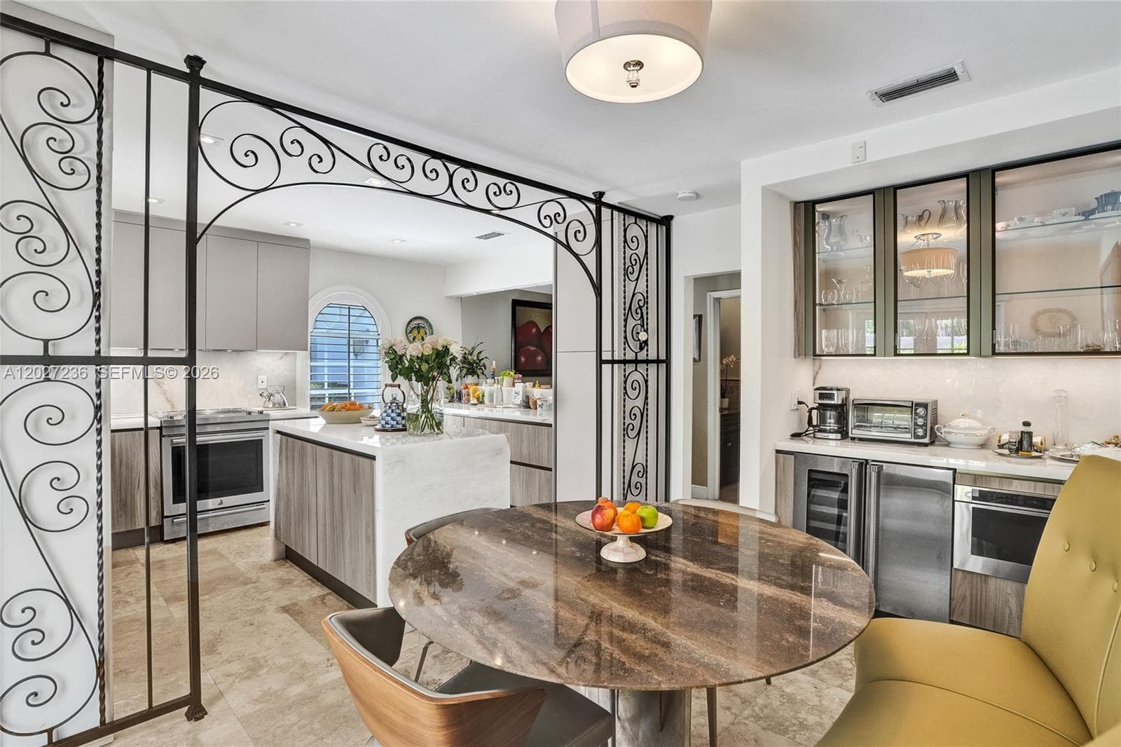 Kitchen has a built in area to eat.