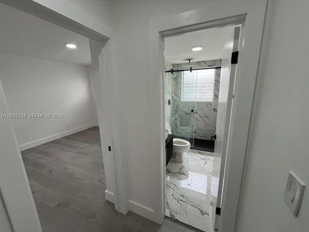 CORRIDOR CUSTOM STONE SHOWER AND SINK