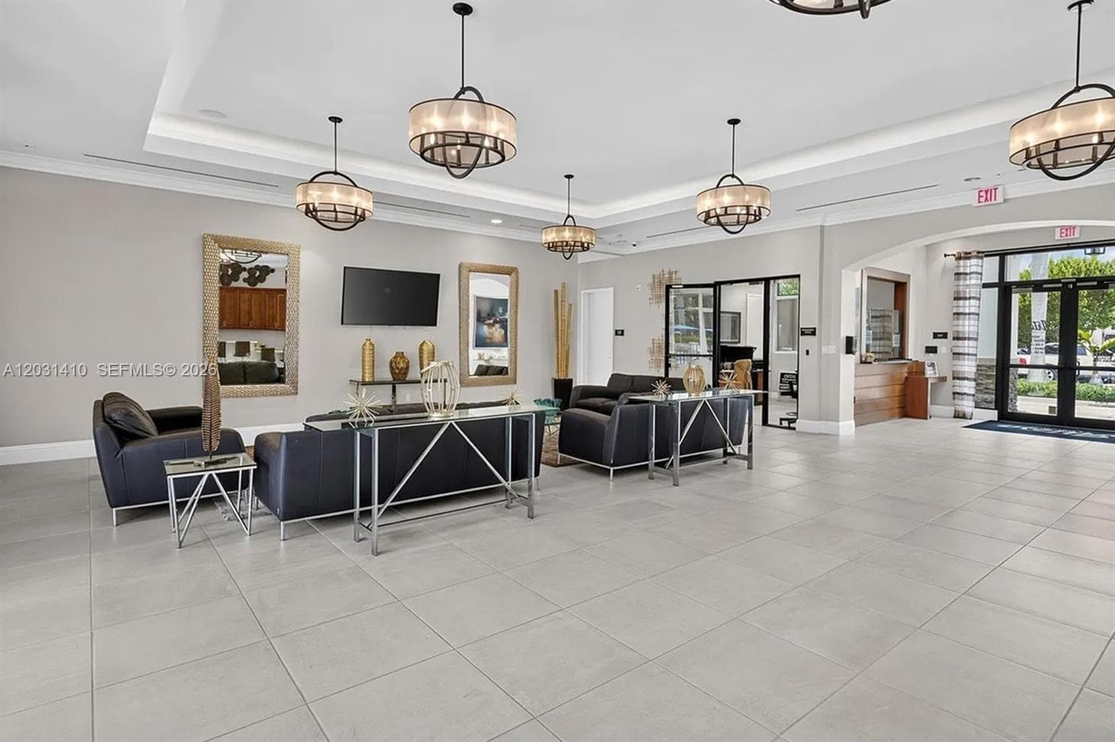 Large-format tile flooring, recessed tray ceiling, and multi-light drum pendant fixtures