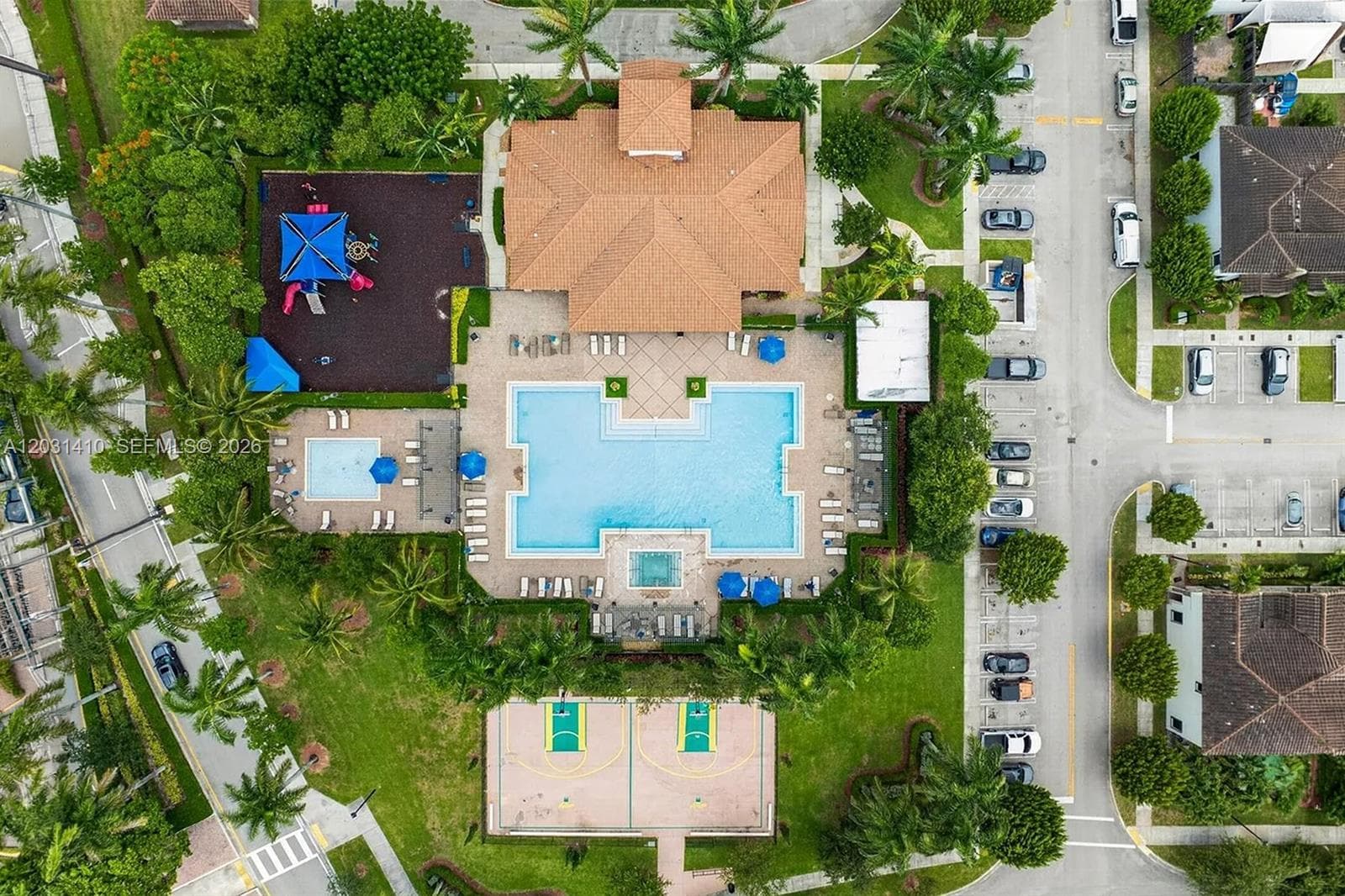 Community recreation center featuring a swimming pool, spa, basketball court, playground, and multi-purpose clubhouse