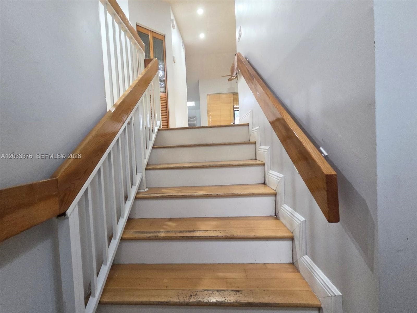 Stairs to open area and unit