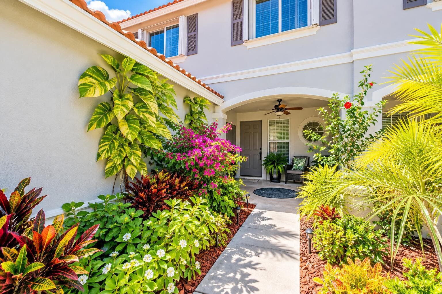 Tropical Stucco Home Entrance Path