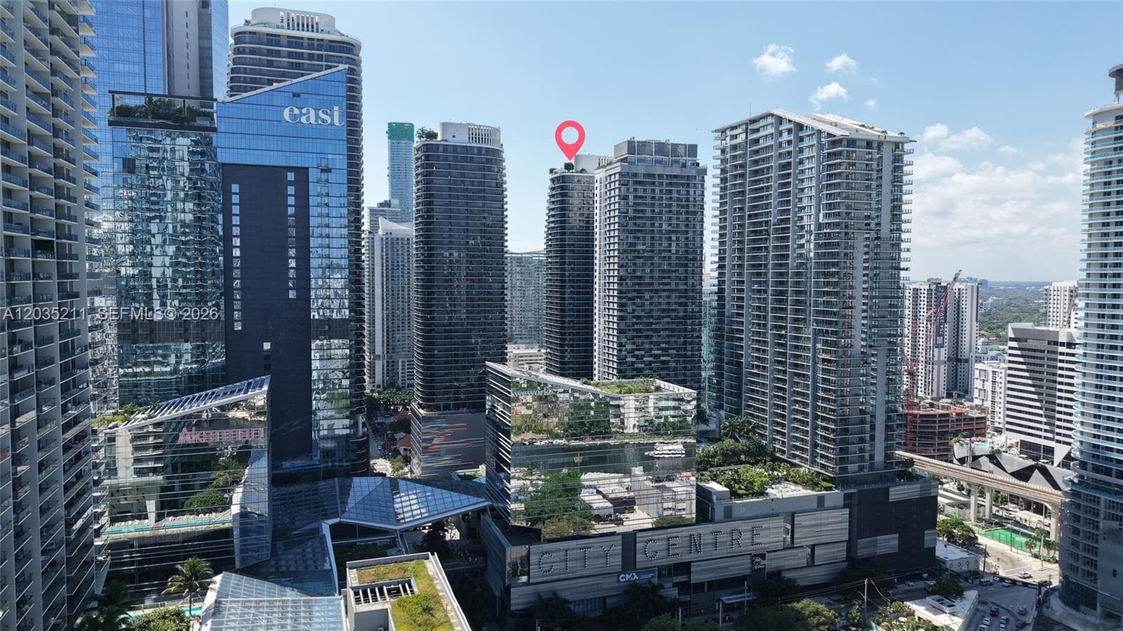 High-rise property featuring a glass-facade exterior and central urban positioning within a metropolitan district