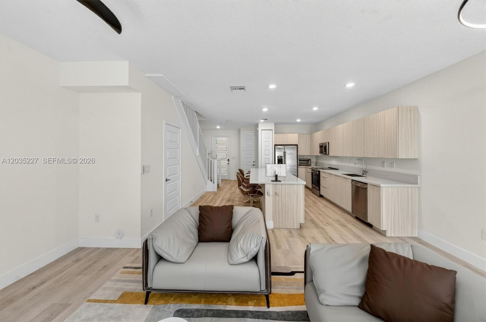 Living and dining room combo seamlessly flows into the chef's kitchen.