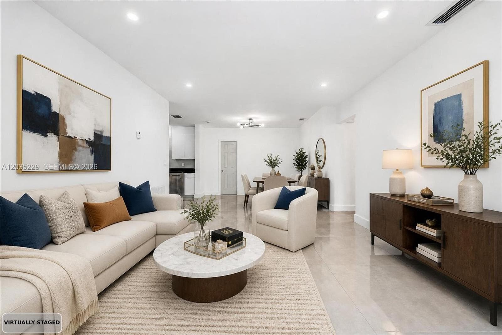 Virtually staged living room showcasing the open-concept layout.