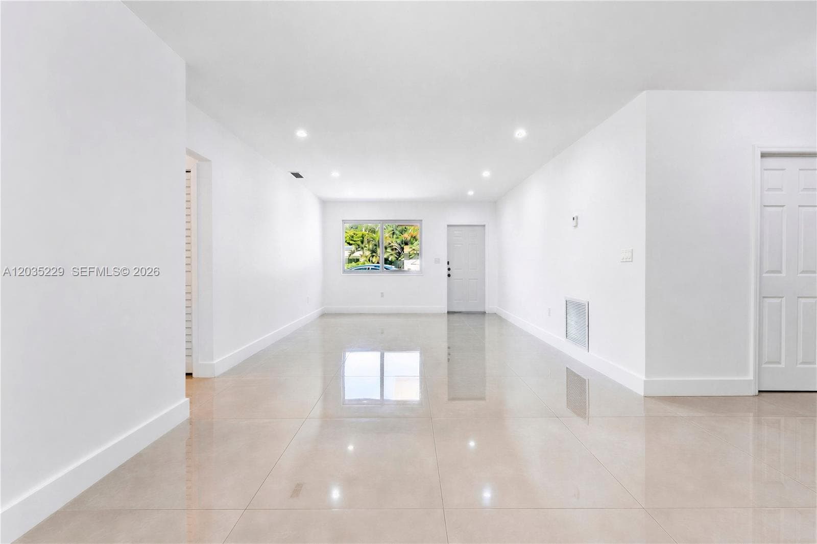 Spacious open-concept living area with abundant natural light.