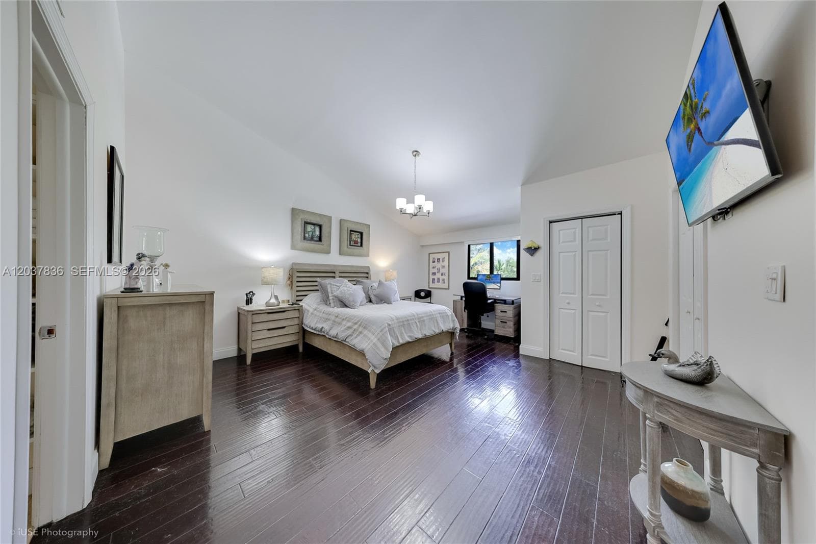 Large Master Bedroom with 2 walking closets and sppace for a desk looking the Golf court