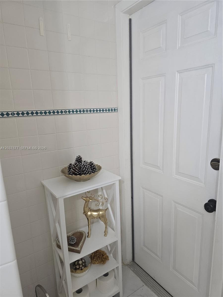 This door in the 2nd bathroom leads outside if you decide to install a pool.