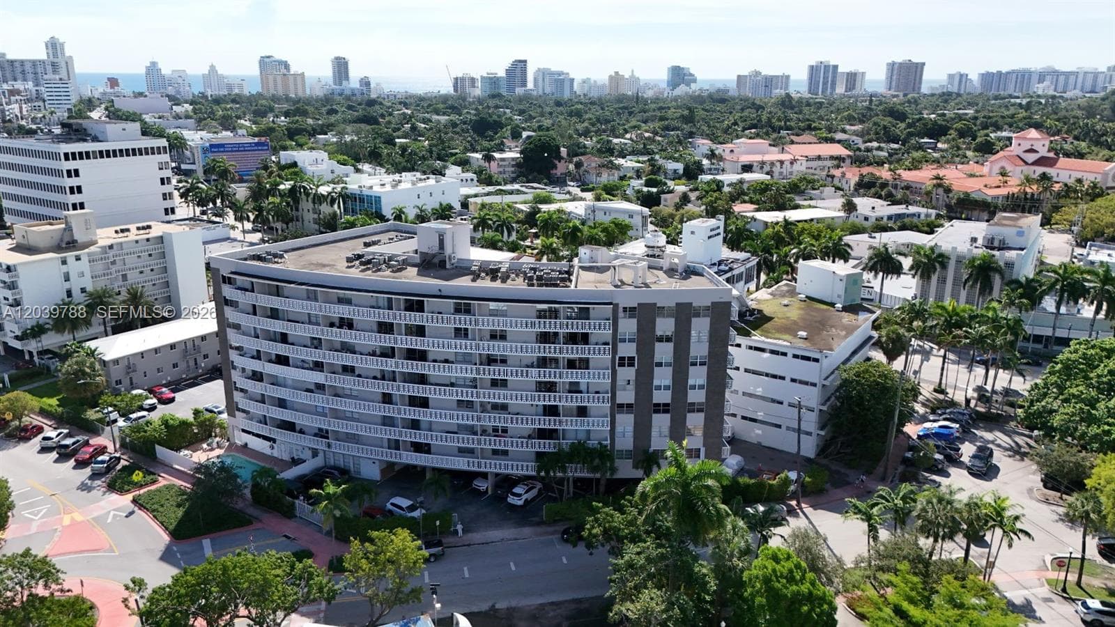Aerial view of building surrounded by picturesque neighborhood.