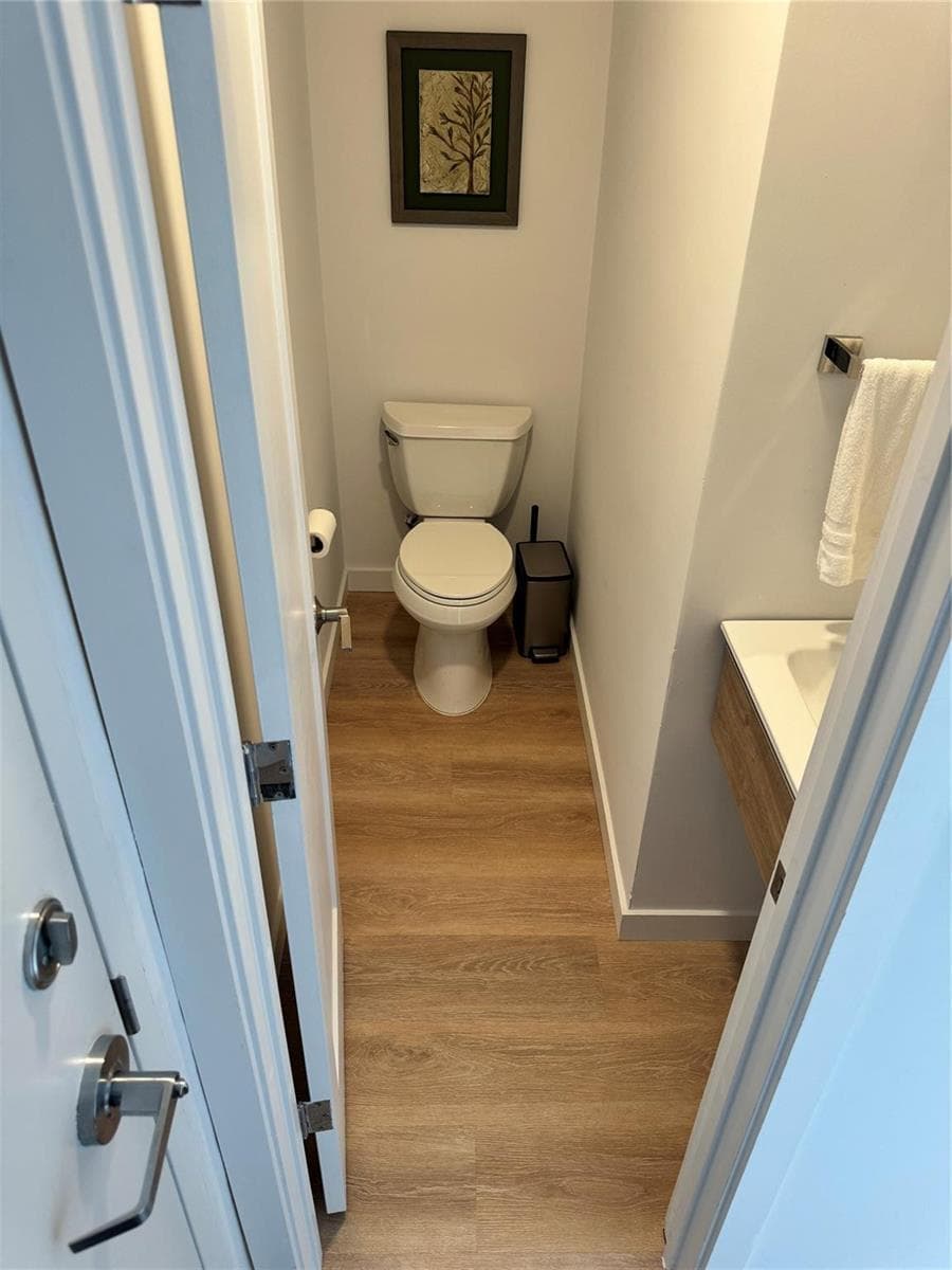 Powder room by entrance to house ...