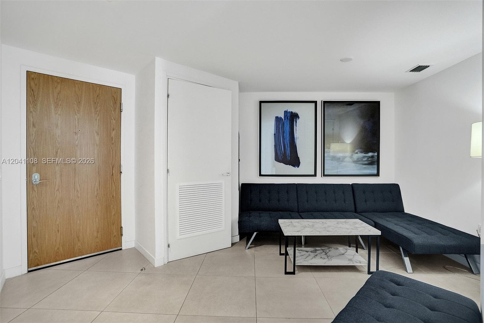 With sofa bed.  Washer and dryer in the closet pictured