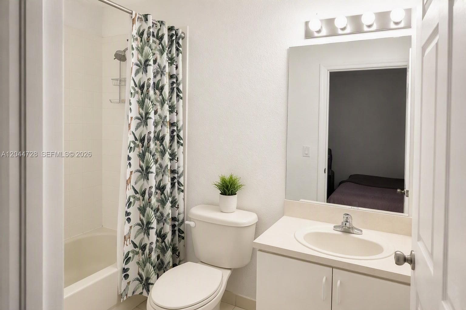 2nd Master Bathroom with white tile flooring, tub and a simple, functional layout, simple layout.
