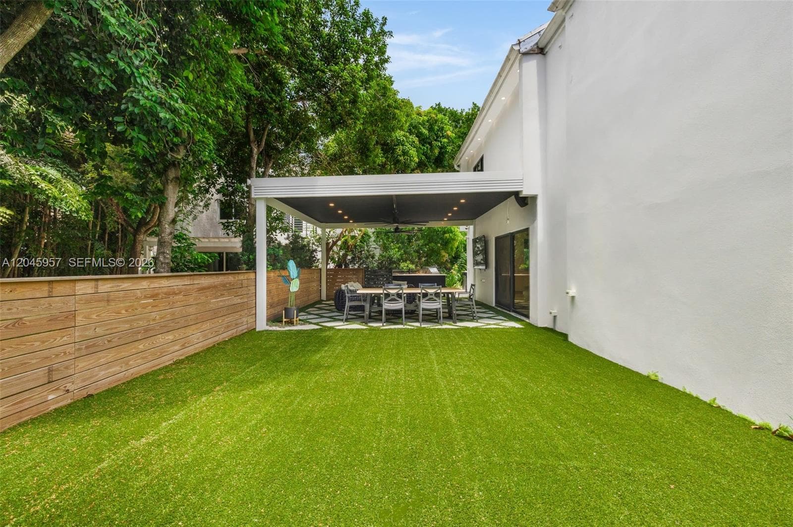 Professionally redesigned outdoor spaces create a private, low-maintenance backyard ideal for entertaining, family gatherings, or quiet evenings at home.