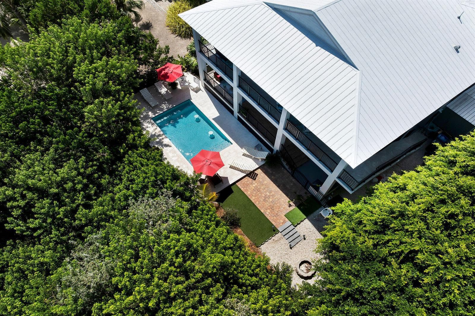 AERIAL VIEW OF POOL AREA AND BACKYARD