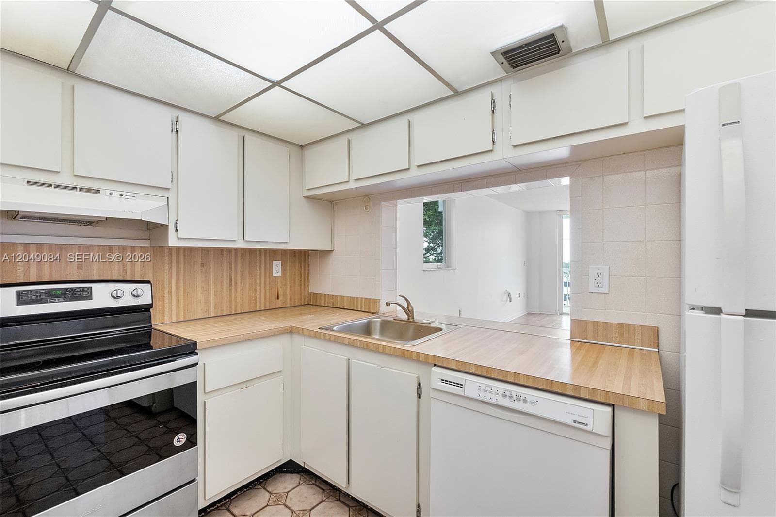 with opening to living & dining areas